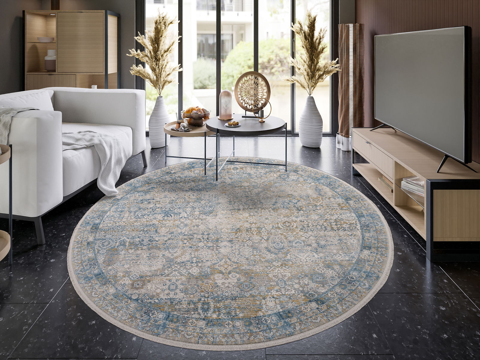 Runder Designer Teppich in einem modernen Wohnzimmer, mit einem eleganten Muster in Blau- und Beigetönen, aus der Vogelperspektive fotografiert.