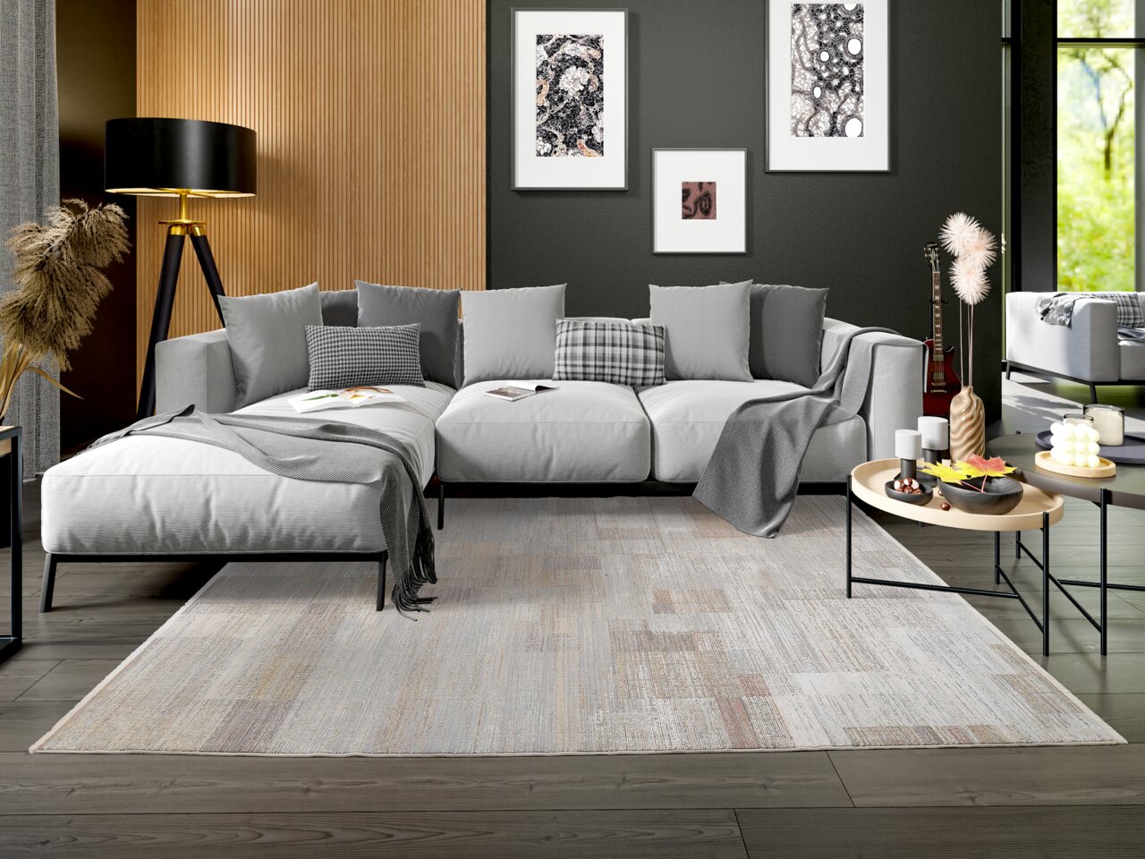 Moderner Designer-Teppich in einem stilvollen Wohnzimmer mit grauem Sofa und dekorativen Kissen, aus der Vorderansicht fotografiert.