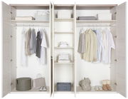 Offener 5-türiger Drehtürenschrank CAMRON mit Kleidung, Regalen und Aufbewahrungskörben, Frontalansicht