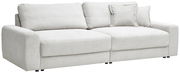 Großes, hellgraues Sofa mit geripptem Stoffbezug, zwei großen Sitzkissen und mehreren Rückenkissen, seitliche Perspektive