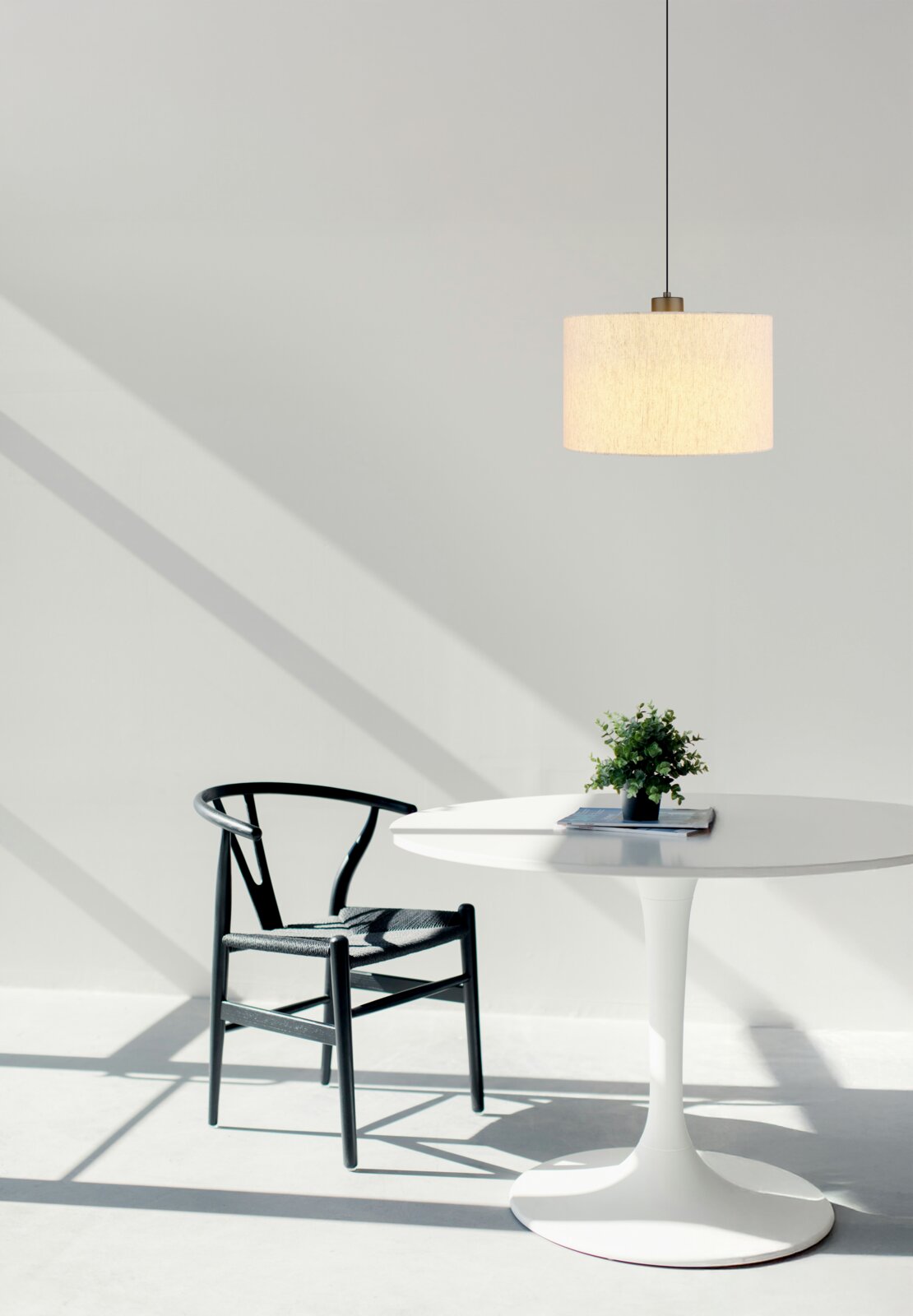 Moderne hanglamp in een minimalistische ruimte, gefotografeerd vanuit een zijaanzicht.