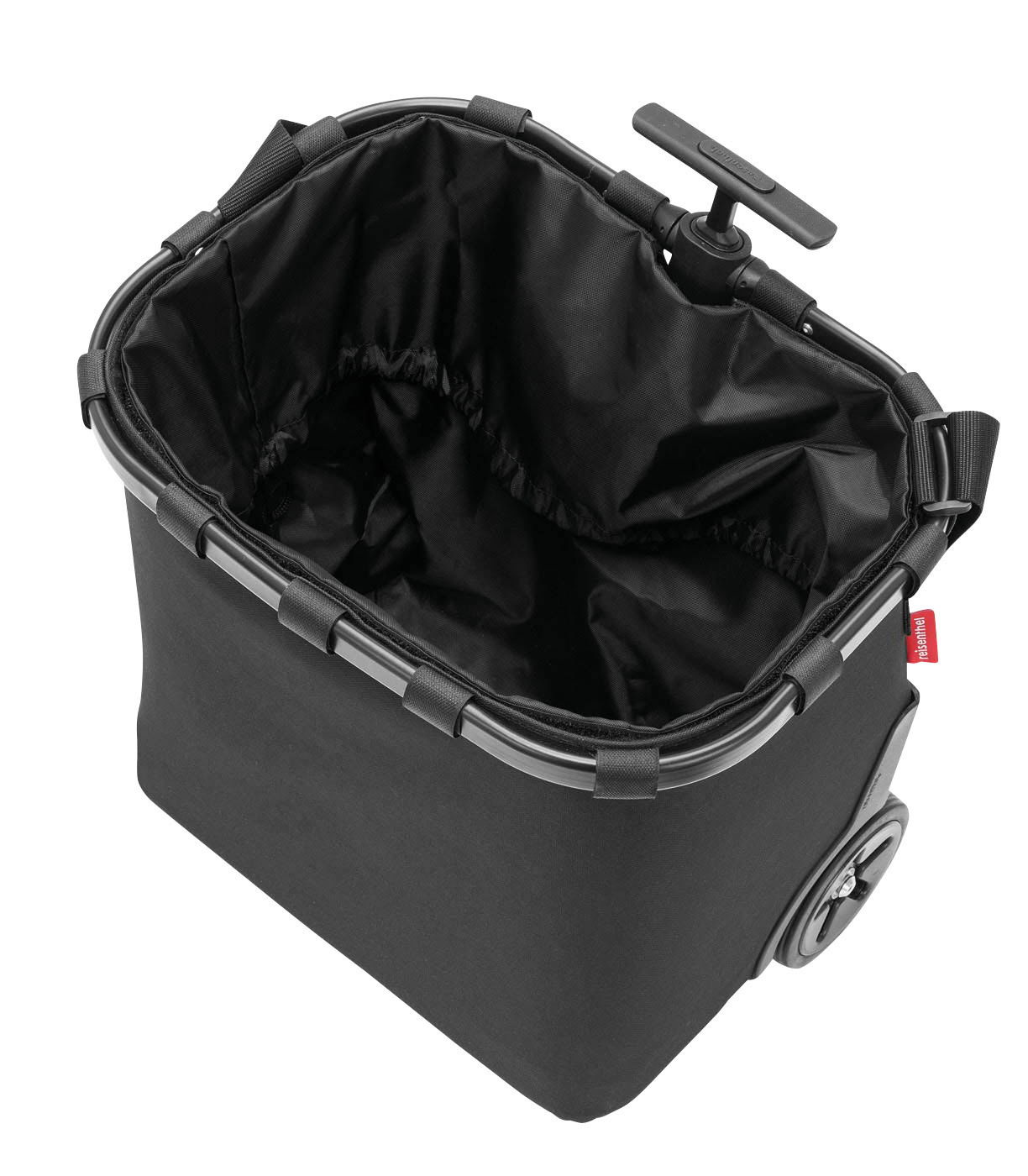 Schwarzer Carrycruiser mit stabilen Rahmen und Rädern, von oben betrachtet.