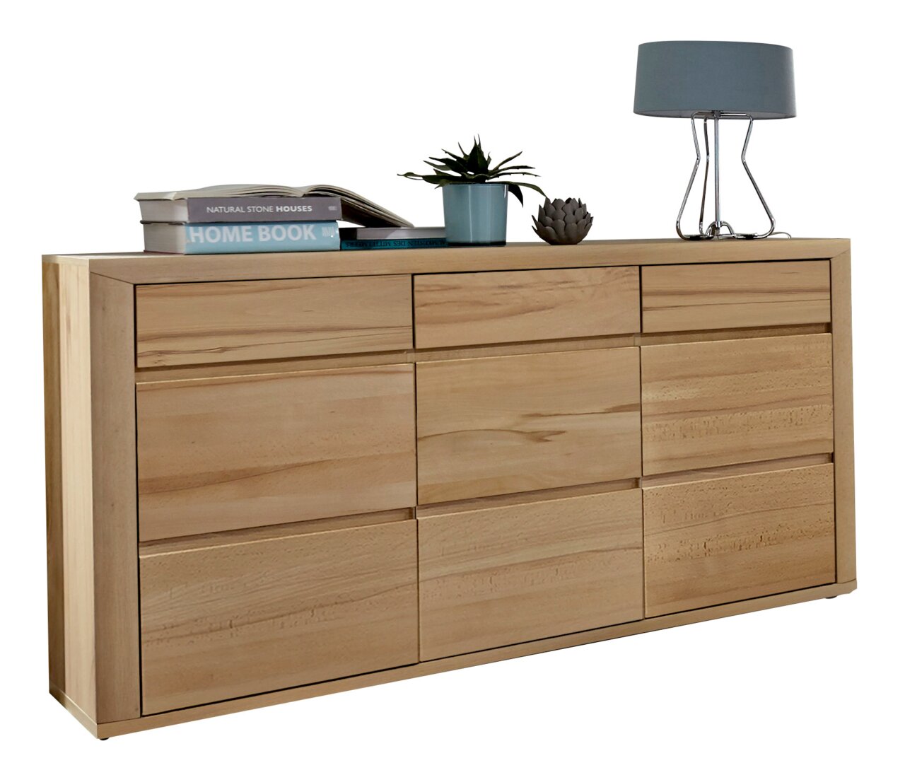 Houten dressoir met meerdere lades, versierd met boeken, een plant en een lamp, zijaanzicht