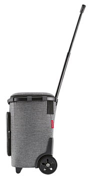 Seitenansicht eines grauen Carrycruiser Plus mit Teleskopgriff und großen Rädern.