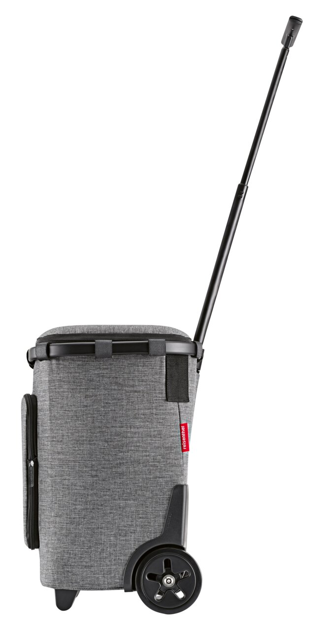 Seitenansicht eines grauen Carrycruiser Plus mit Teleskopgriff und großen Rädern.