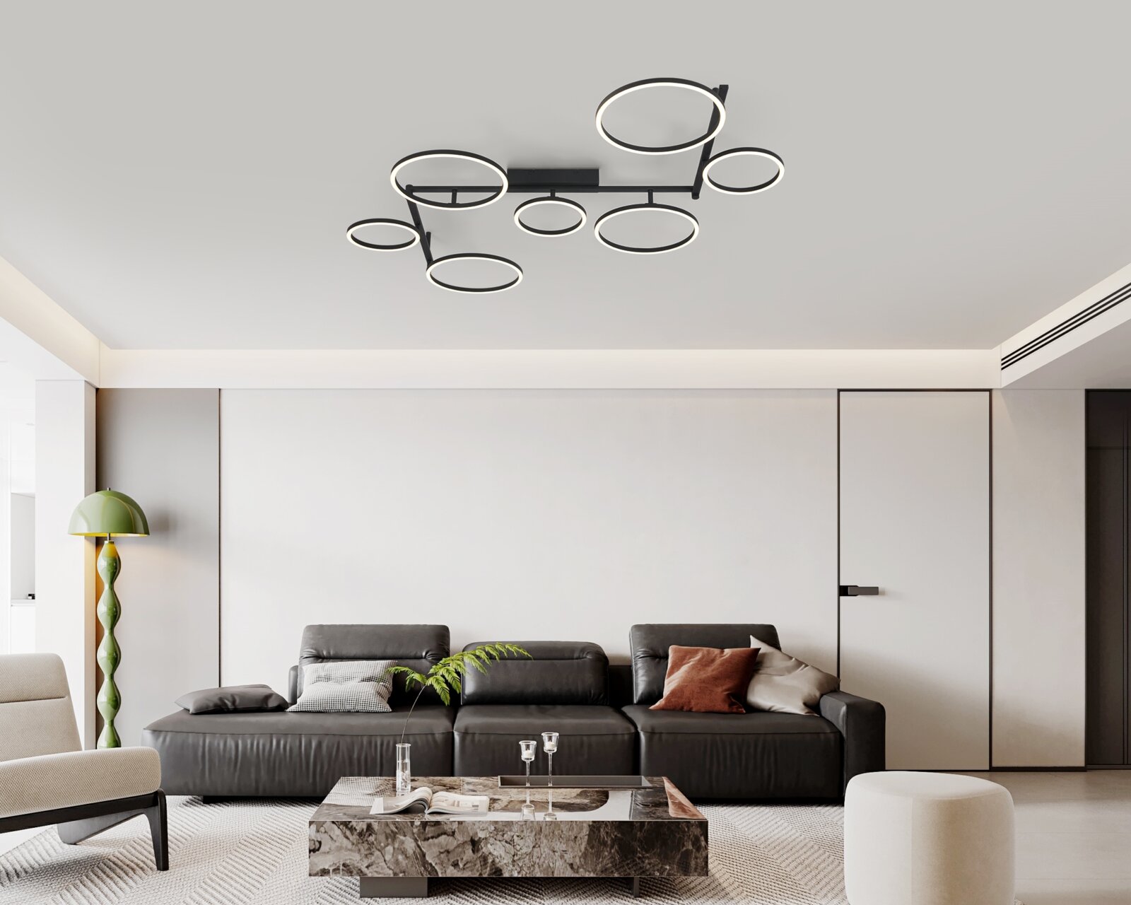 Moderne led-plafondlamp met meerdere ronde lichtringen, van onderaf gezien in een stijlvolle woonkamer.