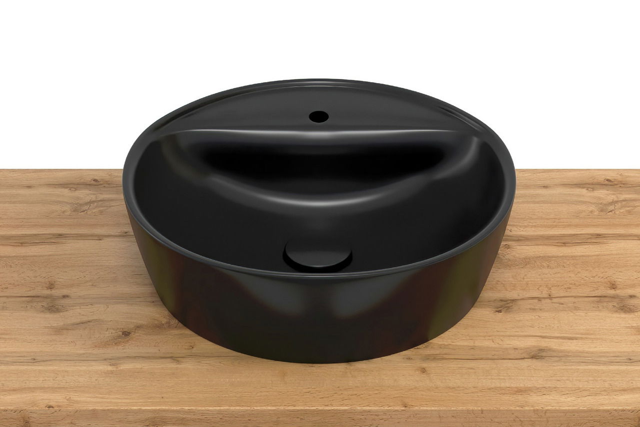 Schwarzes, rundes Waschbecken auf einer Holzoberfläche, Ansicht von oben