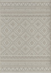 Frontalansicht von einem rechteckigen Teppich in Beige und Creme mit gewebtem Ethno-Muster aus Rauten und Bordüren