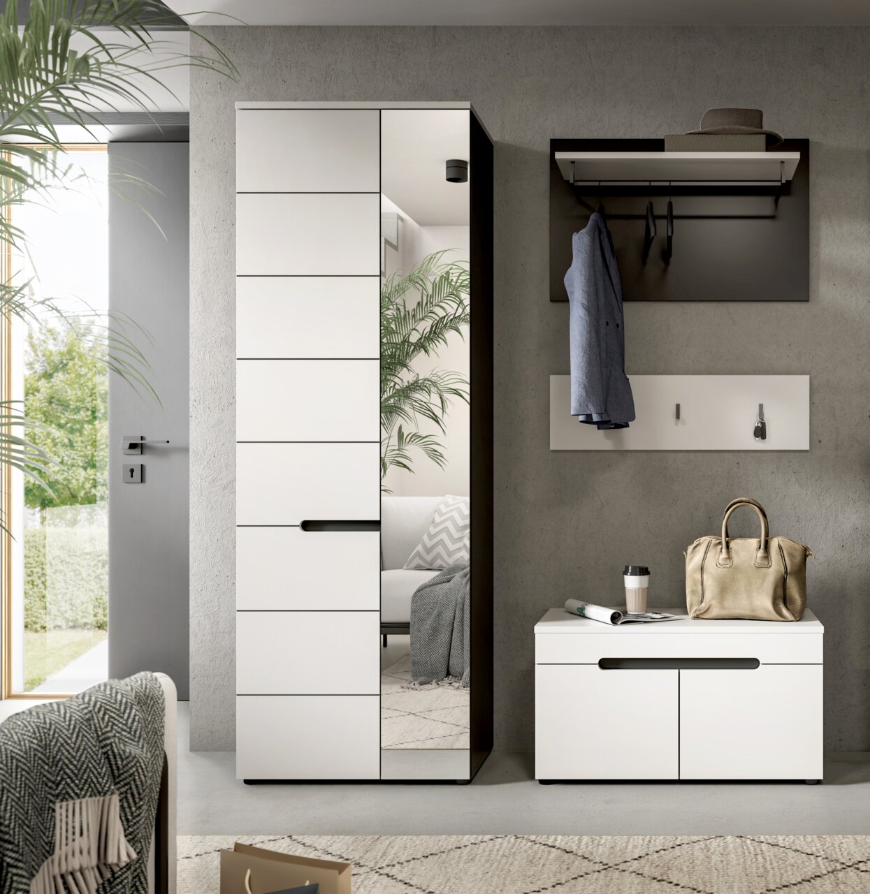 Modernes Garderoben-Set im Flur: hoher weißer Schrank mit Spiegel und schwarzem Rahmen neben weißer Schuhbank und Wandgarderobe, frontal aus leicht seitlicher Perspektive aufgenommen.