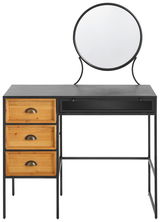 Schminktisch mit rundem Spiegel, drei Holzschubladen auf der linken Seite und schwarzem Metallrahmen, Frontalansicht.