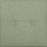 Grüne Sesselauflage in Nahaufnahme von oben, mit zwei sichtbaren Knöpfen in der Mitte.