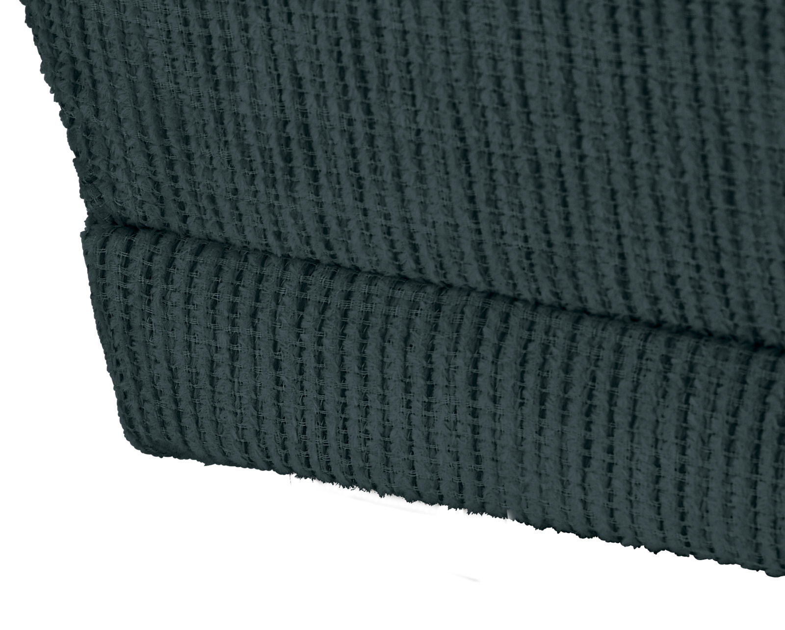 Nahaufnahme eines dunkelgrünen, strukturierten Stoffes einer Recamiere, seitliche Perspektive