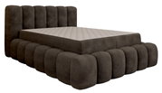 Modern gestoffeerd bed in donkere stof met een gestoffeerd hoofdeinde en afgeronde hoeken, zijaanzicht