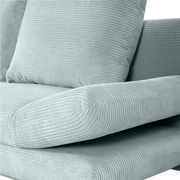 Nahaufnahme eines mintgrünen Funktionssofas ELIO mit geripptem Stoffbezug, seitliche Perspektive