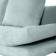 Nahaufnahme eines mintgrünen Funktionssofas ELIO mit geripptem Stoffbezug, seitliche Perspektive