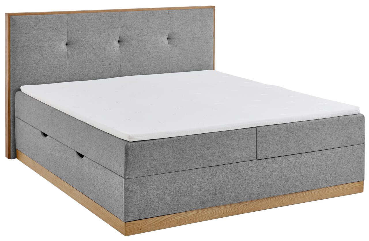 Graues Boxbett mit Holzdetails, seitliche Perspektive