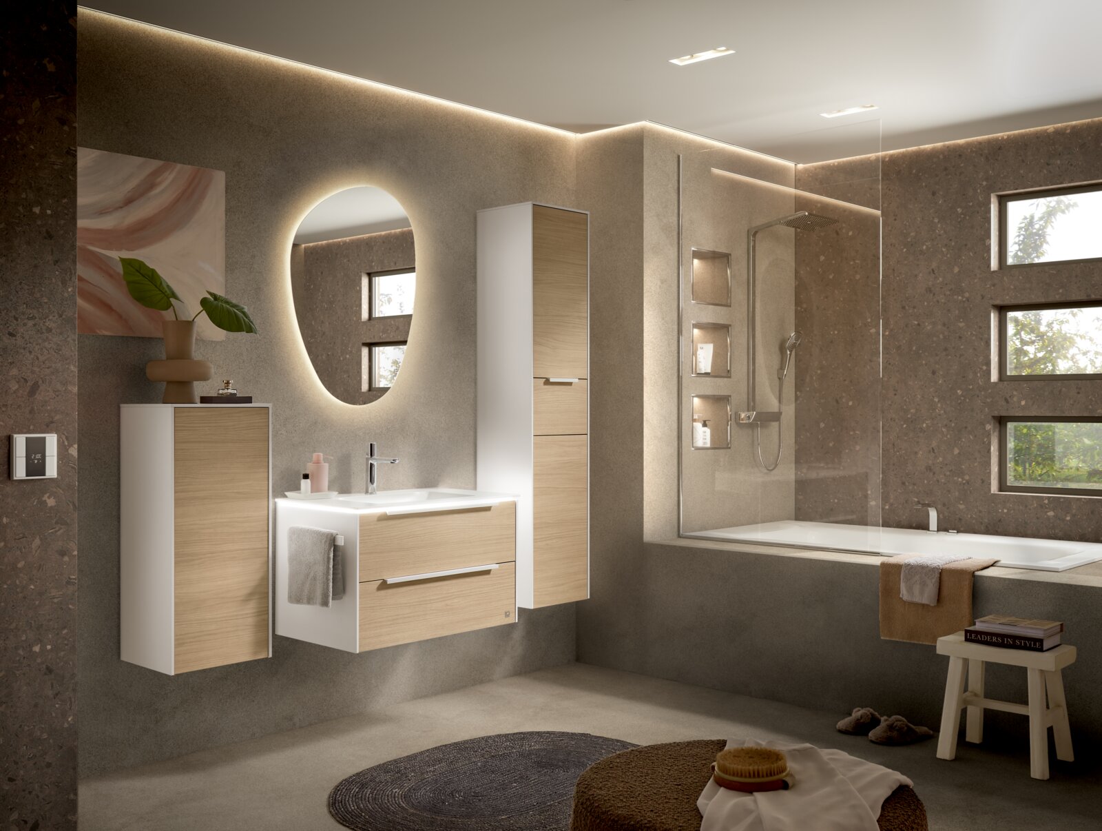 Moderne badkamer met een aan de muur bevestigde wastafel en een hoge kast in wit met houtlook, een ovale verlichte spiegel en een badkuip met glazen douchewand; perspectief: licht schuin breedbeeldperspectief van voren.