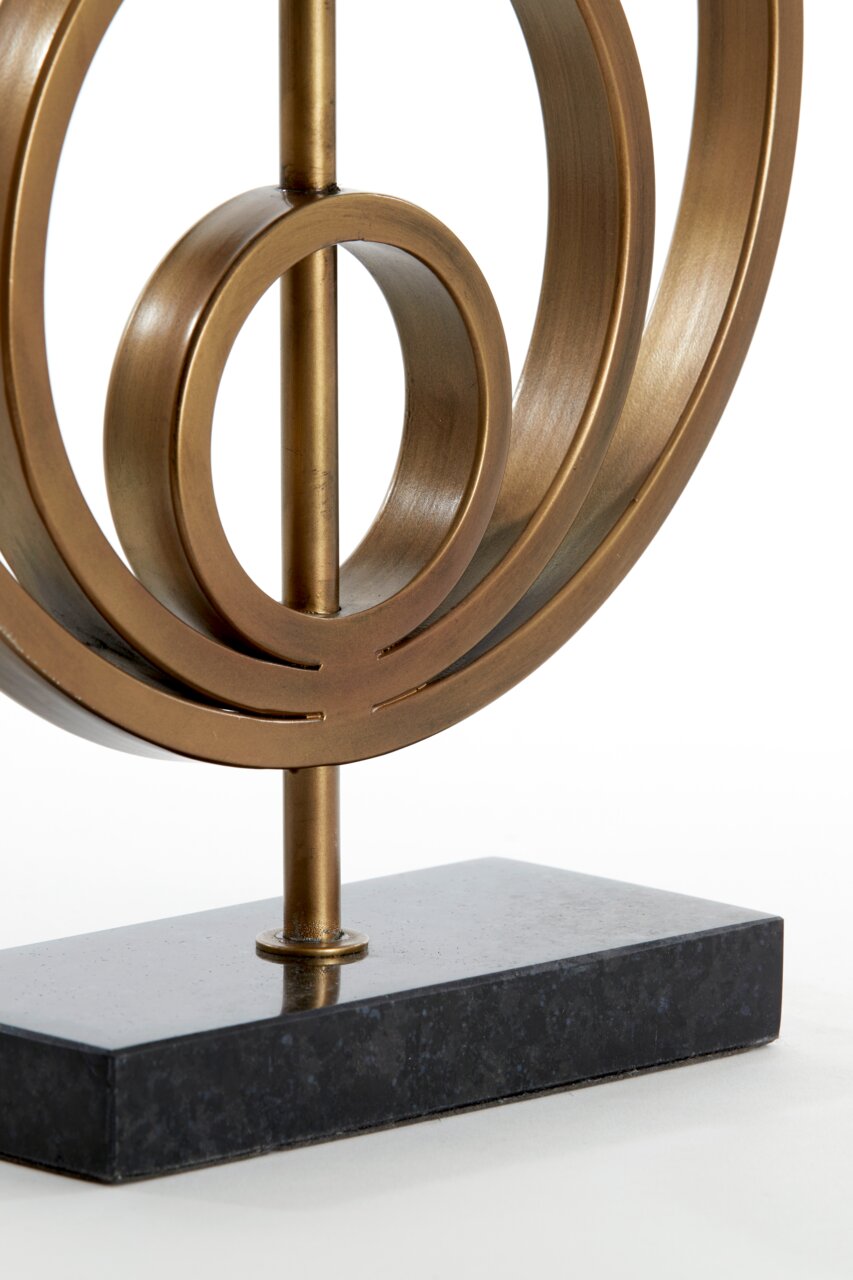 Light&Living Lampenfuß CASSEL Nahaufnahme eines modernen Lampenfußes aus Metall mit kreisförmigem Design auf einem dunklen Sockel, seitliche Perspektive.