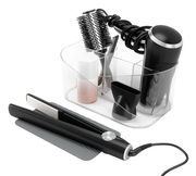 Transparenter Organizer für Haarwerkzeuge mit Fächern, gefüllt mit Föhn, Rundbürste und Haarglätter, aus der Vorderansicht.