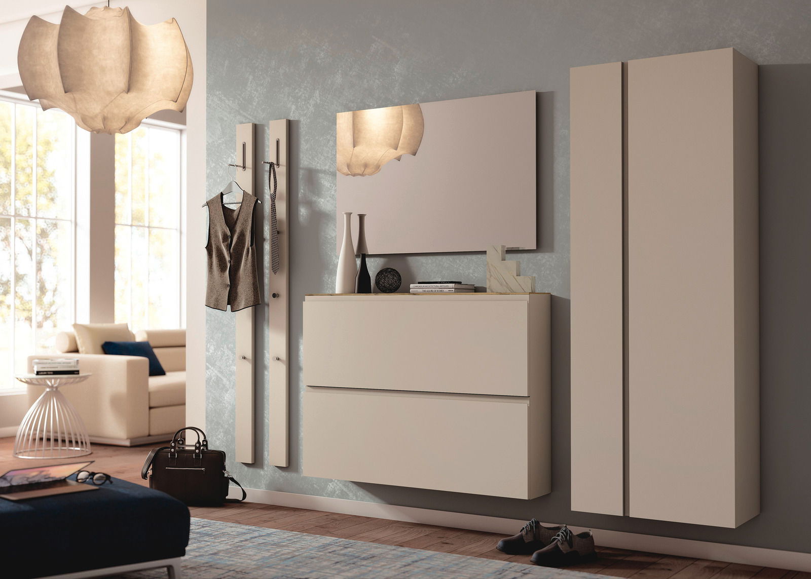 Moderano Hangende schoenenkast LECCO Moderner Hängeschuhschrank in einem stilvollen Wohnzimmer, frontal betrachtet. Der Schrank hat zwei Schubladen und ist in einem eleganten Beige gehalten. Daneben befinden sich ein Spiegel und eine Garderobe.