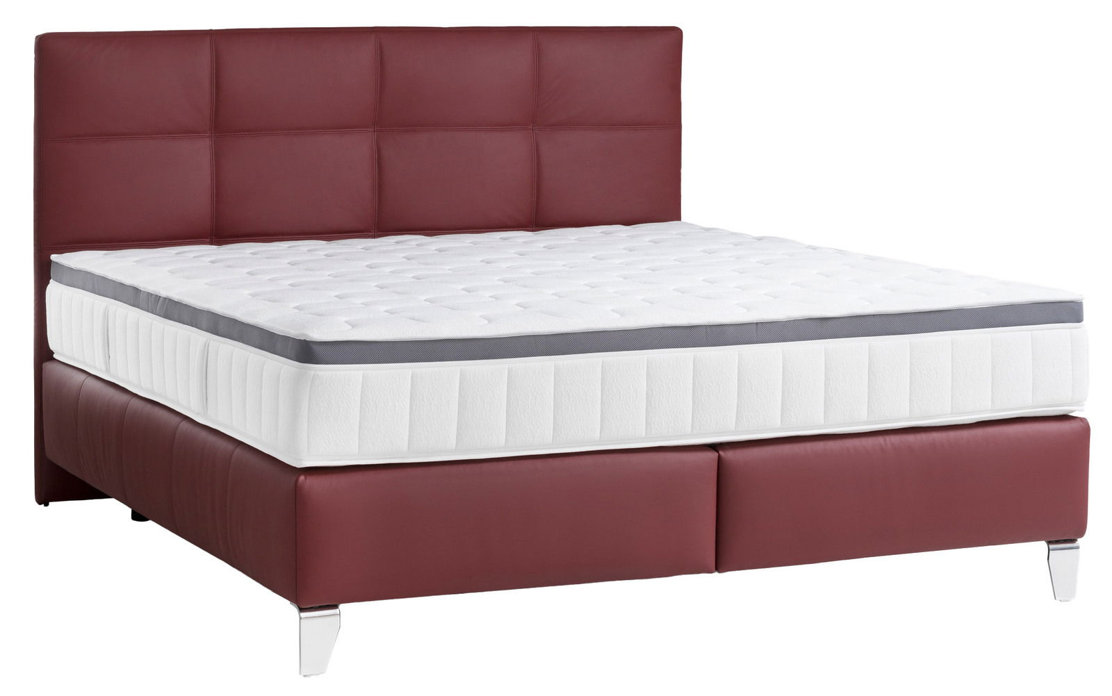 Boxspringbett mit rotem Kopfteil und weißer Matratze, seitliche Perspektive