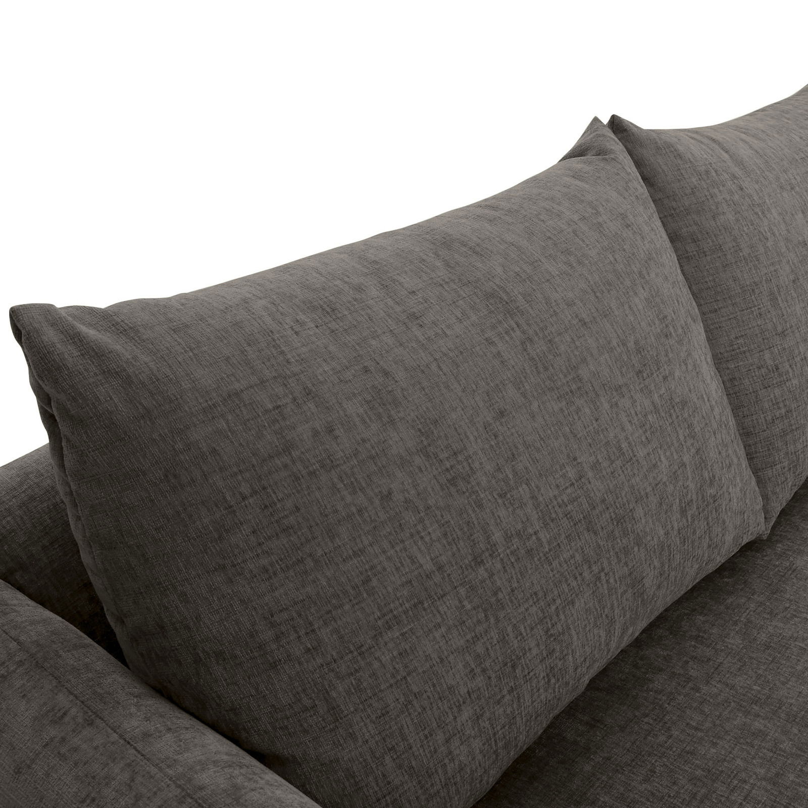 Nahaufnahme einer grauen Sofaecke mit zwei großen Kissen, Perspektive von oben.