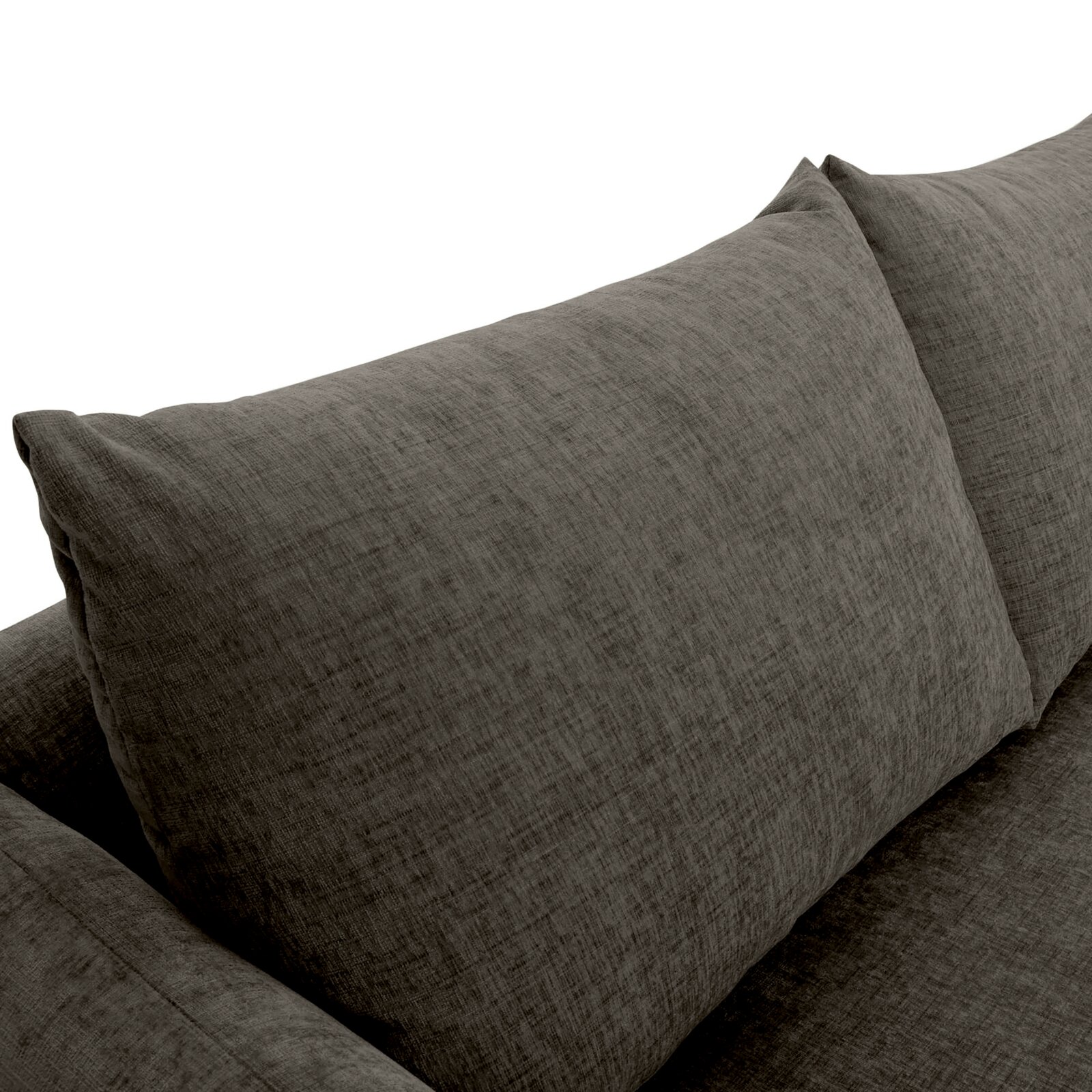 Nahaufnahme einer grauen Sofaecke mit zwei großen Kissen, Perspektive von oben.
