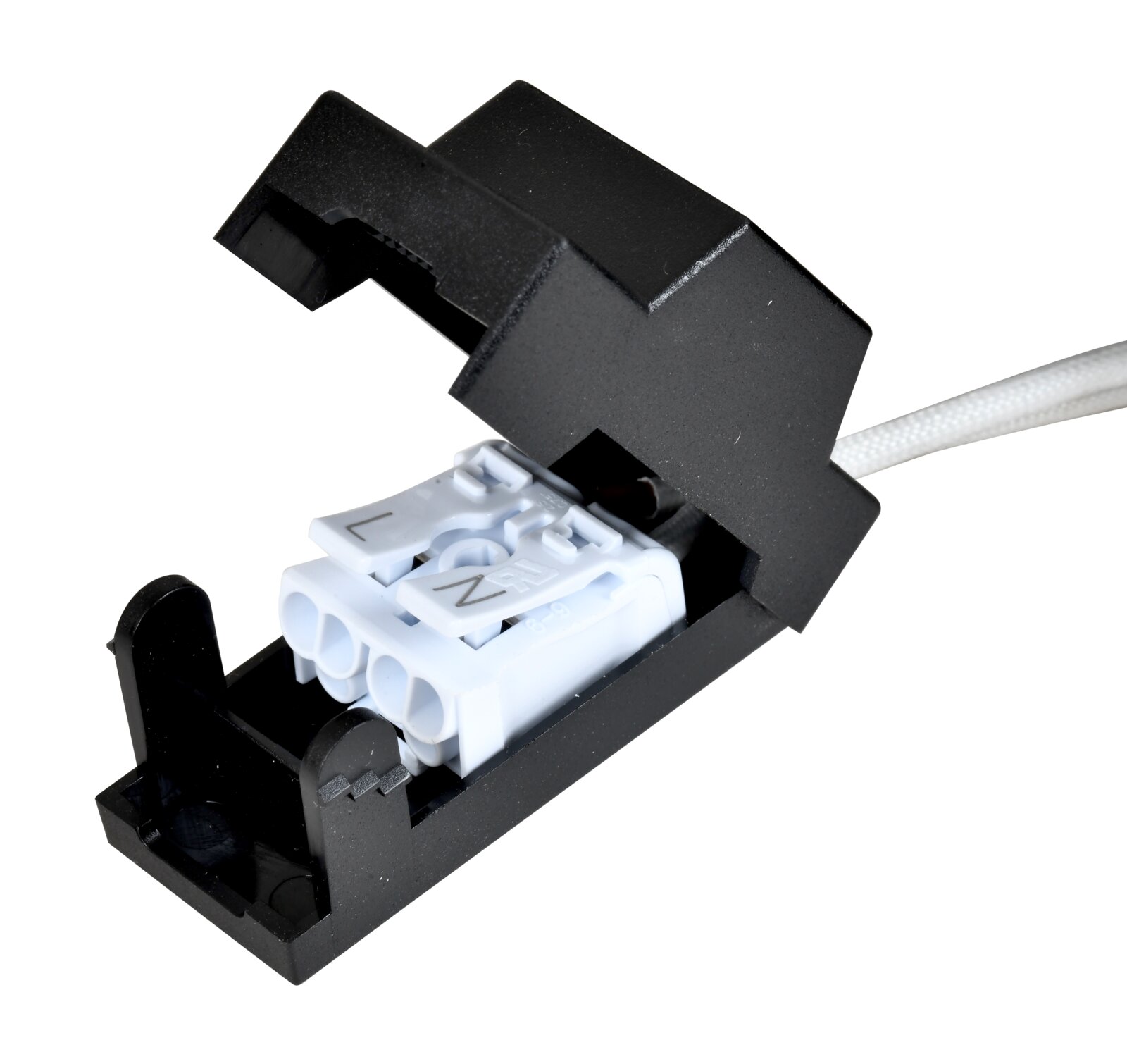 Close-up van een zwarte aansluitdoos met zichtbare witte klemmen voor een led-plafondlamp, gezien van bovenaf.