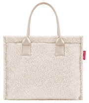 Vooraanzicht van een crèmekleurige shopper met een zachte, donzige textuur en twee handvatten.