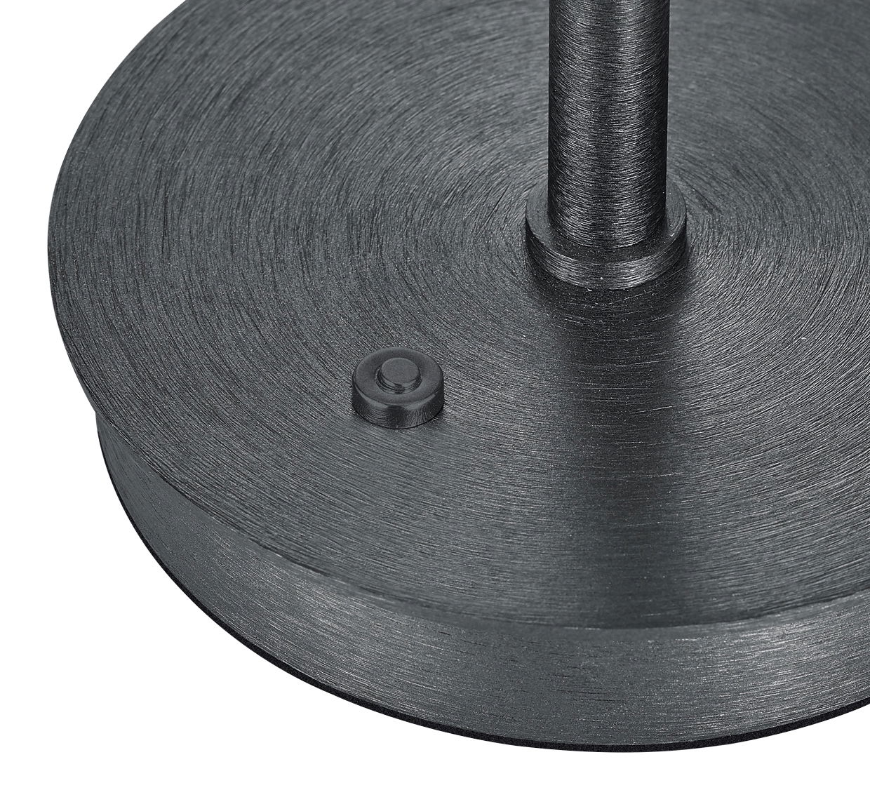 Nahaufnahme der Basis einer LED-Tischleuchte KLARA in schwarzem Metall mit einem runden Schalter, von oben betrachtet.