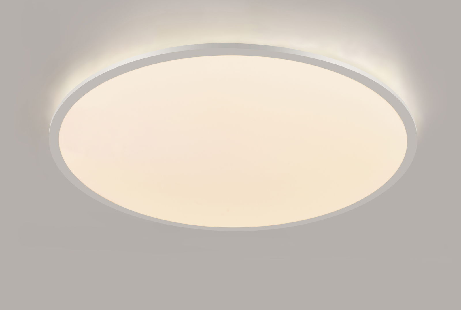 Runde LED-Deckenleuchte in Seitenansicht, leuchtend mit sanftem Licht.