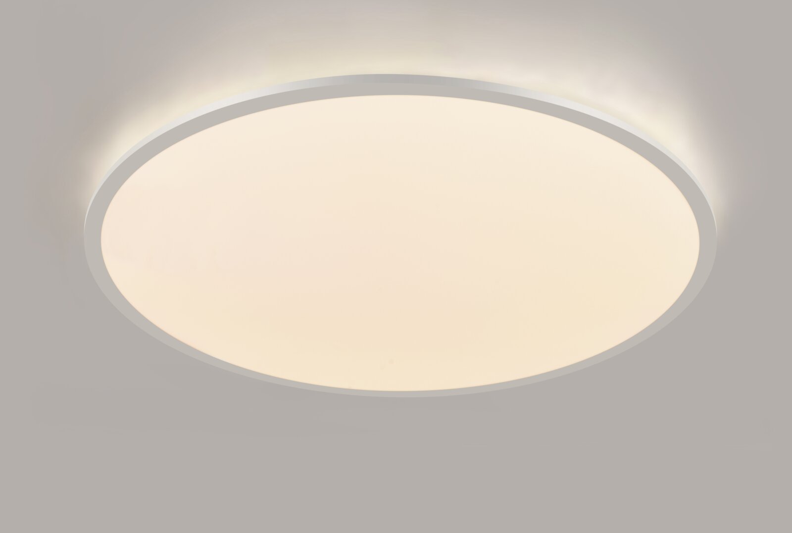Ronde led-plafondlamp in zijaanzicht, die een zacht licht verspreidt.