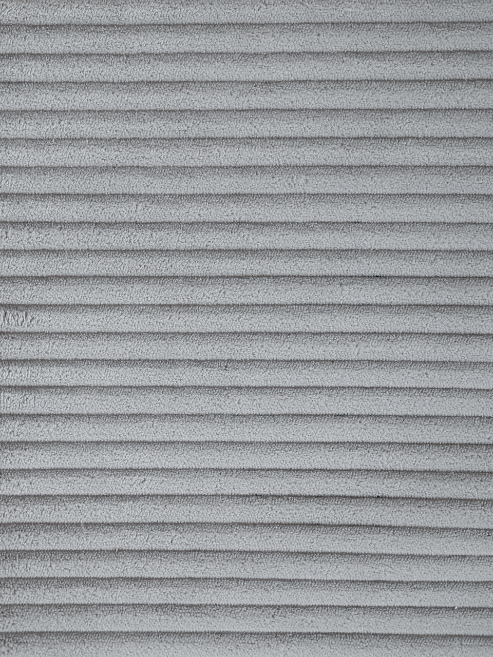 Nahaufnahme eines grauen, gerippten Stoffes, möglicherweise für einen Schwingstuhlbezug.