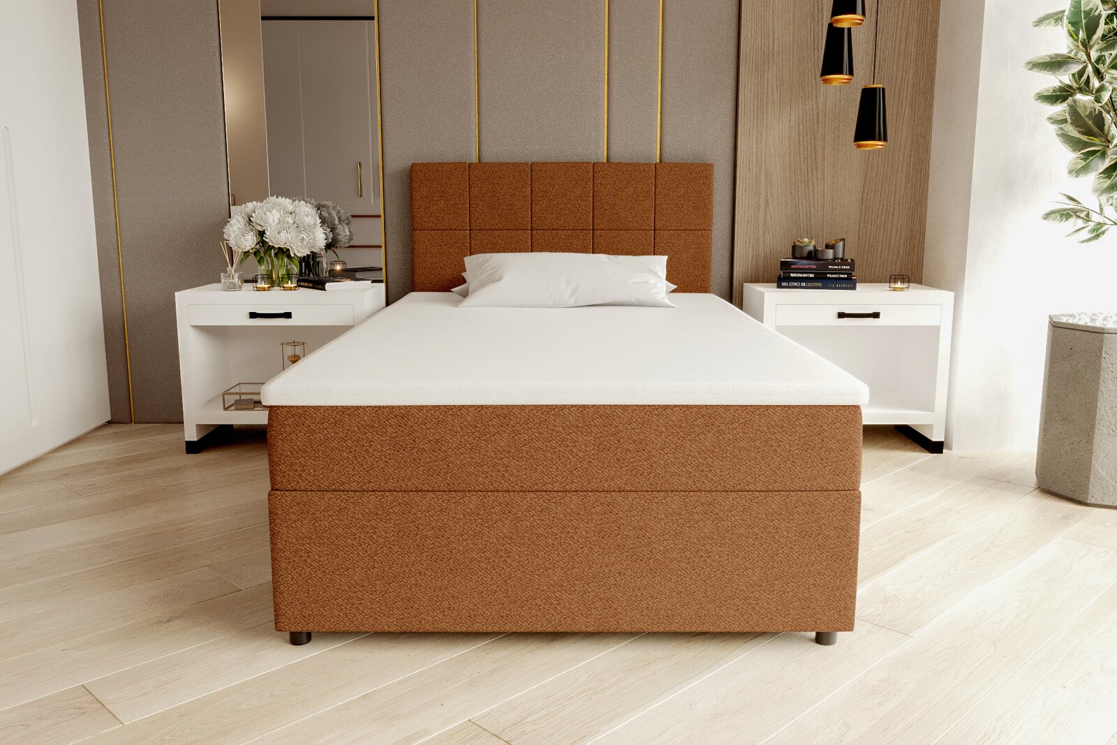 Modernes Boxspringbett in warmem Braun mit gepolstertem, quadratisch gestepptem Kopfteil und weißer Matratze im hellen Schlafzimmer, frontale Ansicht aus leicht erhöhter Perspektive