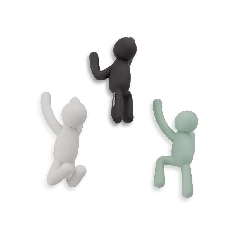 Zurbrüggen Buddy Wandhaken Multicolor Drei bunte Wandhaken in Form von kletternden Figuren, aus der Vogelperspektive betrachtet.