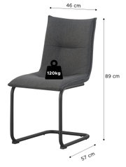 Gepolsterter Freischwinger-Stuhl in Dunkelgrau mit schwarzem Metallgestell, Maße ca. 46 cm Breite, 89 cm Höhe und 57 cm Tiefe, belastbar bis 120 kg, Ansicht schräg von vorne.