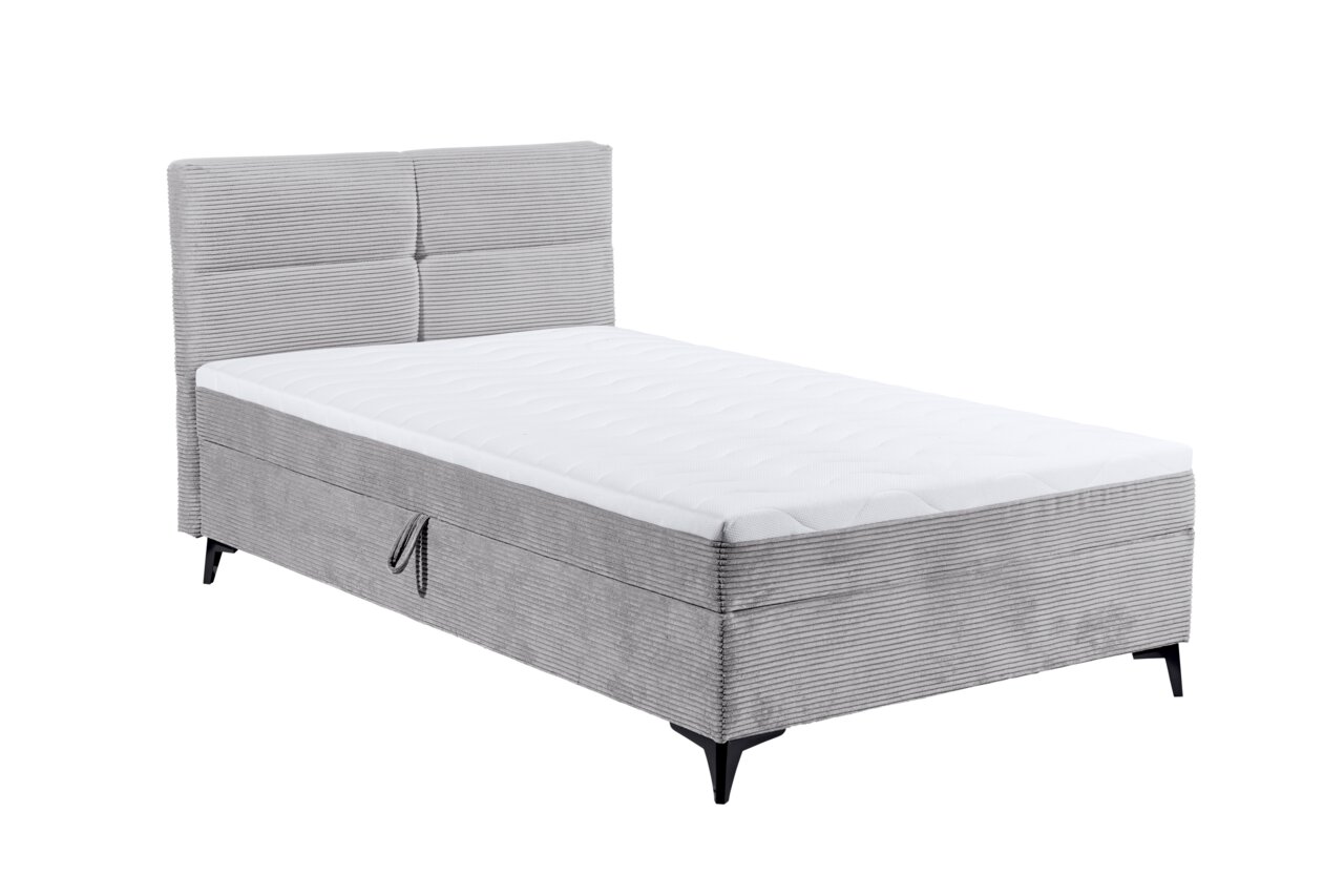 Graues Boxbett mit gestepptem Kopfteil und weißer Matratze, seitliche Perspektive