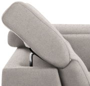 Nahaufnahme einer grauen Rundecke mit verstellbarer Kopfstütze, seitliche Perspektive