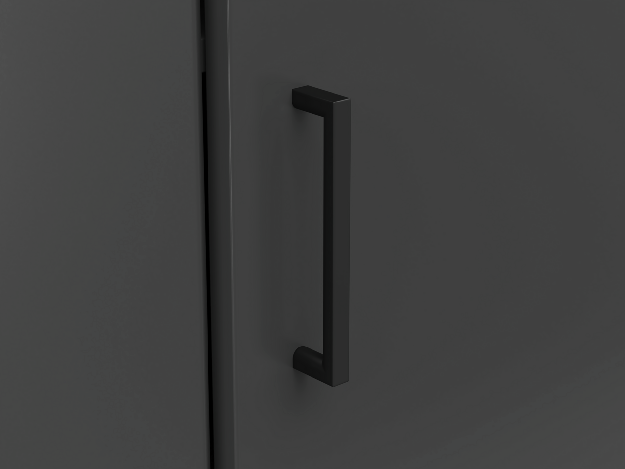 Carryhome Eckkommode MULTISTAURAUM Nahaufnahme eines schwarzen Türgriffs an einer dunklen Eckkommode, seitliche Perspektive