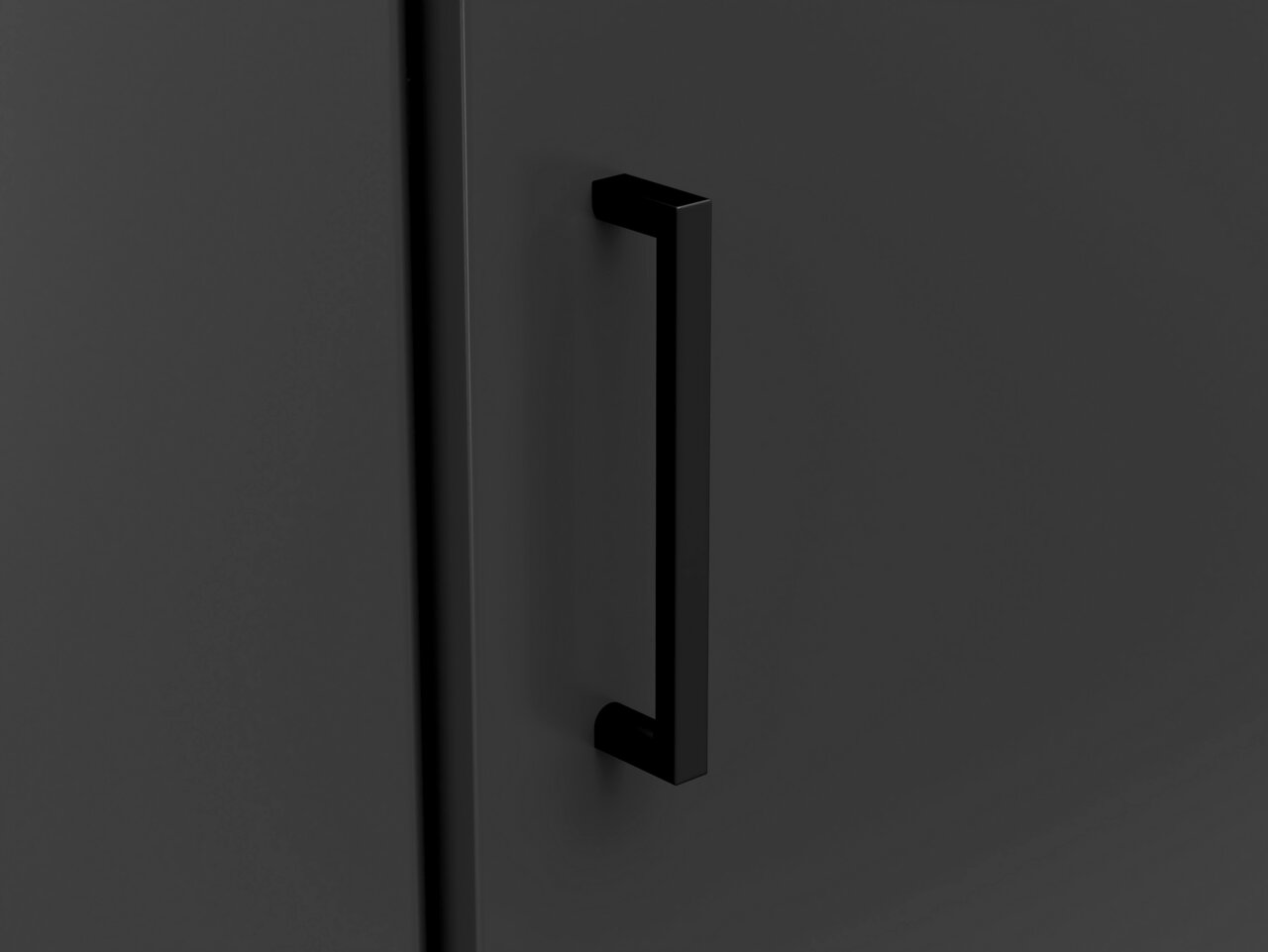 Nahaufnahme eines schwarzen Türgriffs an einer dunklen Eckkommode, seitliche Perspektive