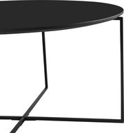 Moderner Couchtisch mit runder schwarzer Tischplatte und filigranem Metallgestell, seitliche Perspektive