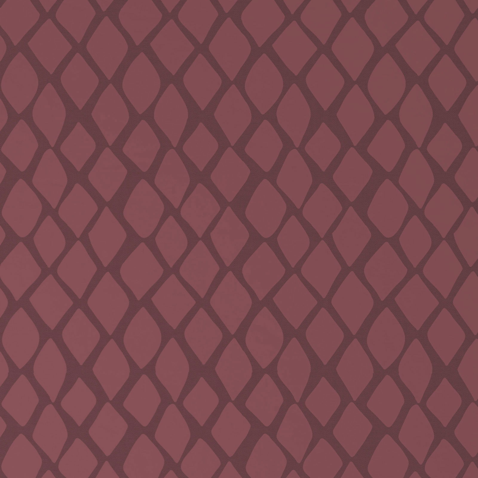 Nahaufnahme einer Wendebettwäsche mit rautenförmigem Muster in dunklem Rot.