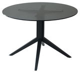 Runder Esstisch mit schwarzer Glasplatte und stabilem Metallgestell, seitliche Perspektive