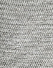 Nahaufnahme eines grauen Stoffmusters, das für einen Armlehnstuhl verwendet wird, aus der Vogelperspektive.