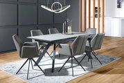 Moderner Esstisch mit grauer Tischplatte und schwarzen Metallbeinen, umgeben von sechs grauen Stühlen in einem stilvollen Esszimmer, seitliche Perspektive.