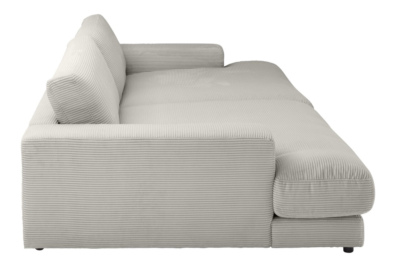Seitenansicht eines kleinen Megasofas mit hellgrauem, geripptem Stoffbezug und breiten Armlehnen.