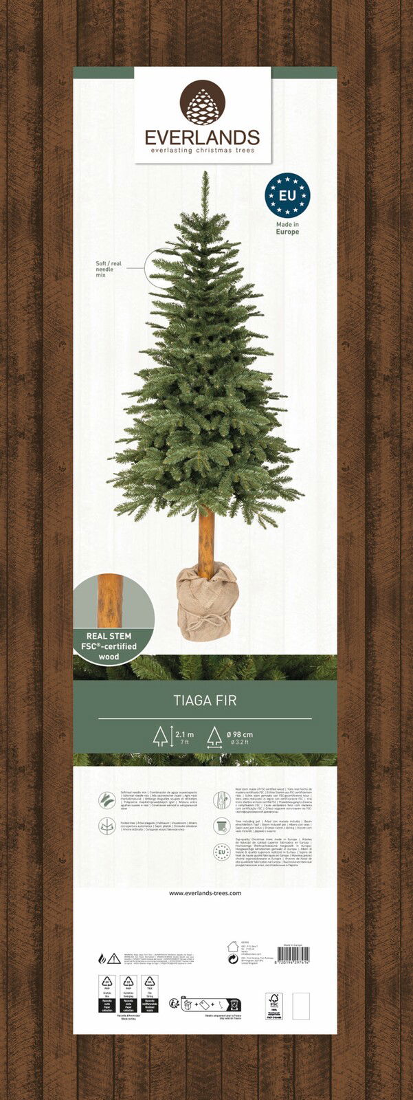 Künstlicher Weihnachtsbaum Tiaga Tanne, 210 cm hoch, mit echtem Holzstamm und weichen Nadeln, frontal abgebildet.