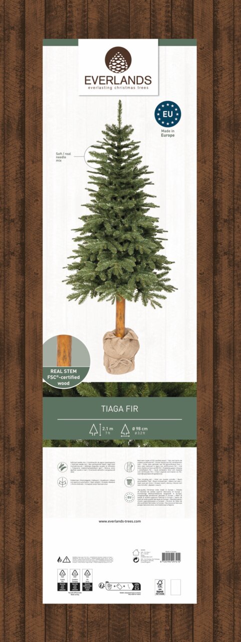 Kunstkerstboom Tiaga-spar, 210 cm hoog, met een stam van echt hout en zachte naalden, afgebeeld van voren.