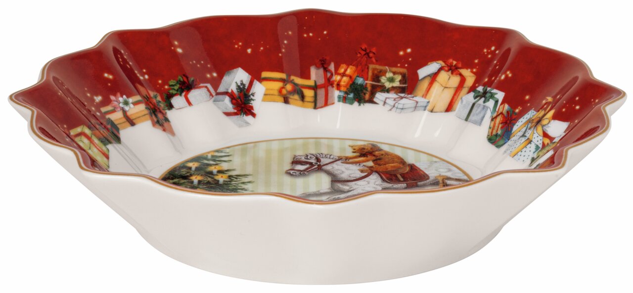 Kleine schaal met kerstmotief, met daarop cadeautjes en een beer op een hobbelpaard, gezien vanuit een zijdelingse hoek