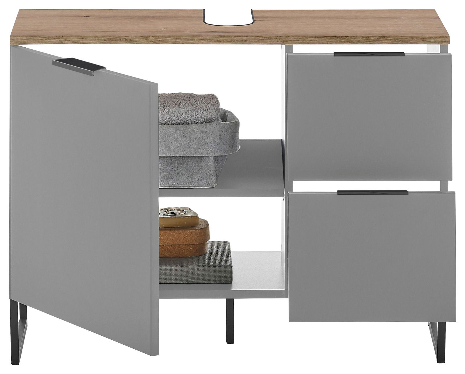 Moderner Waschbeckenunterschrank mit grauen Türen und Holzplatte, teilweise geöffnet, mit Handtüchern und Accessoires, Frontalansicht.